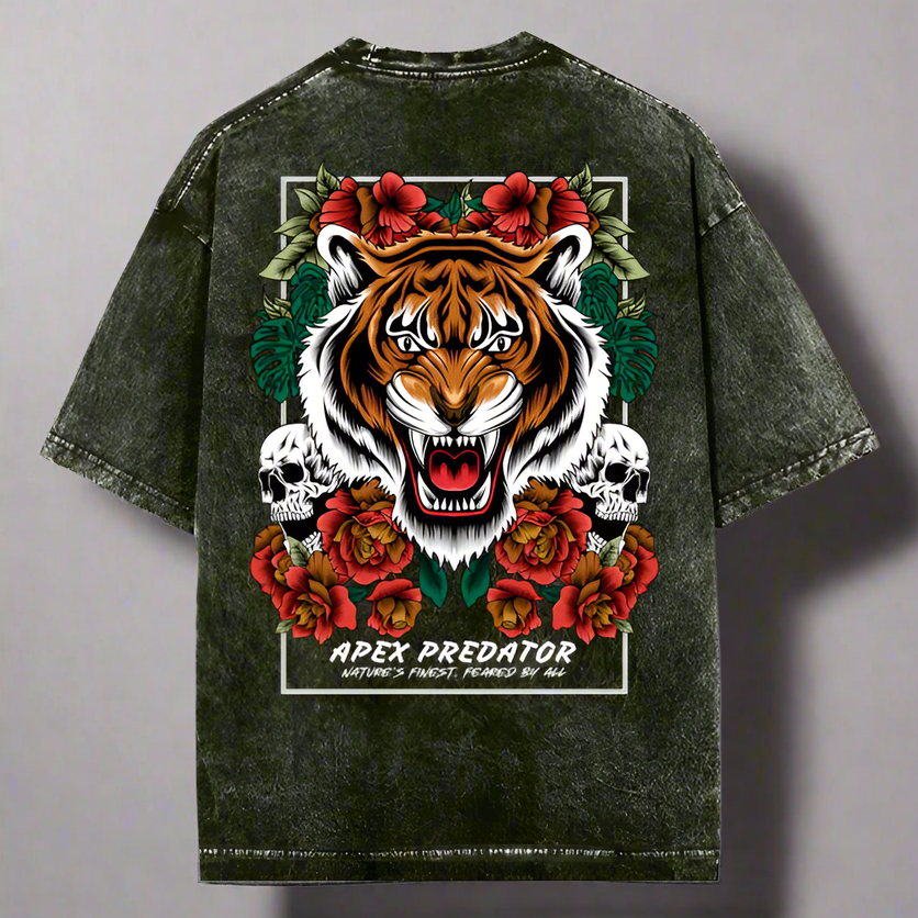 Oversized green t-shirt with a front graphic of a tiger and the text 'APEX PREDATOR', surrounded by floral elements and skulls.